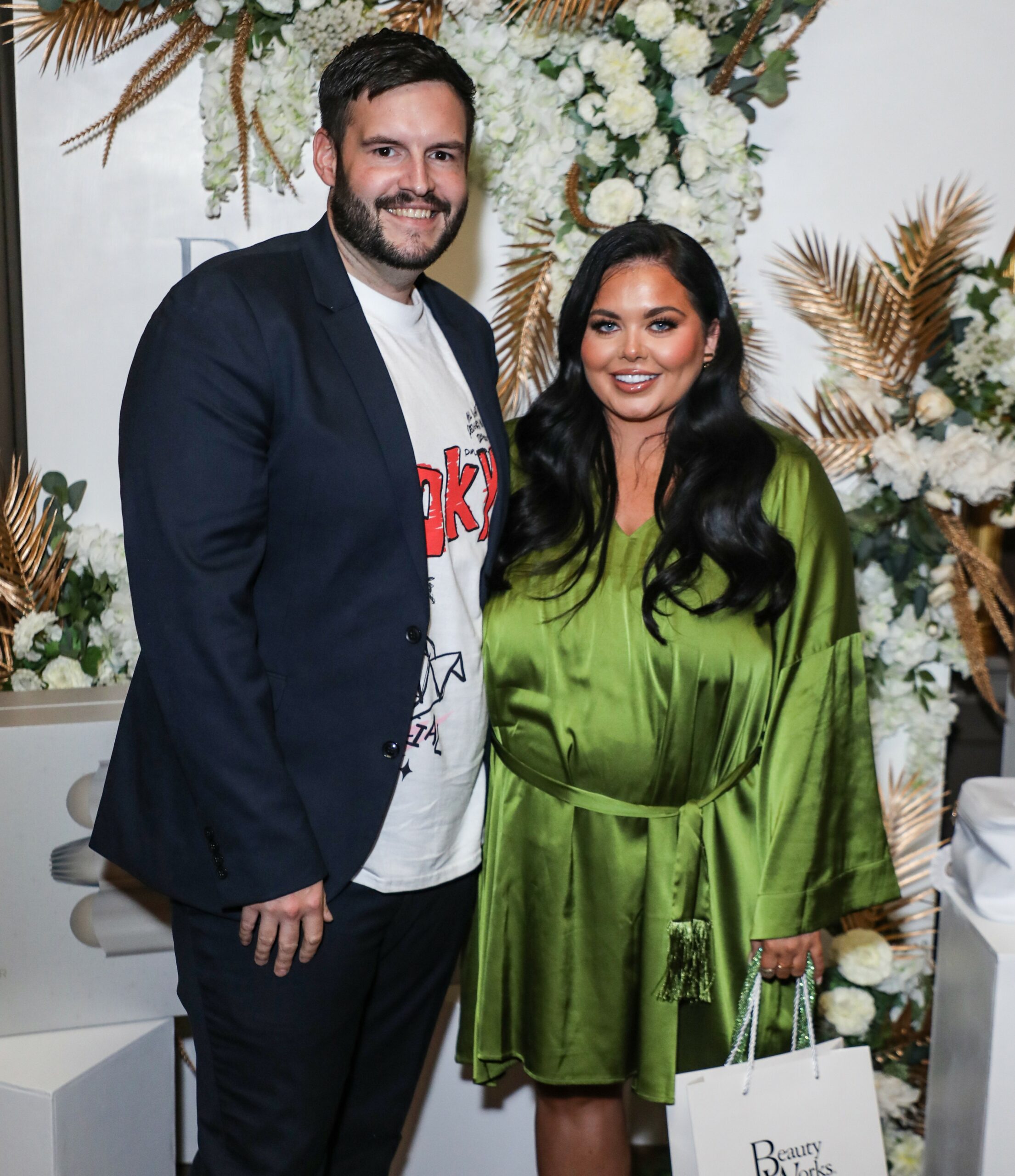 Scott Dobinson and Scarlett Moffatt smiling at event