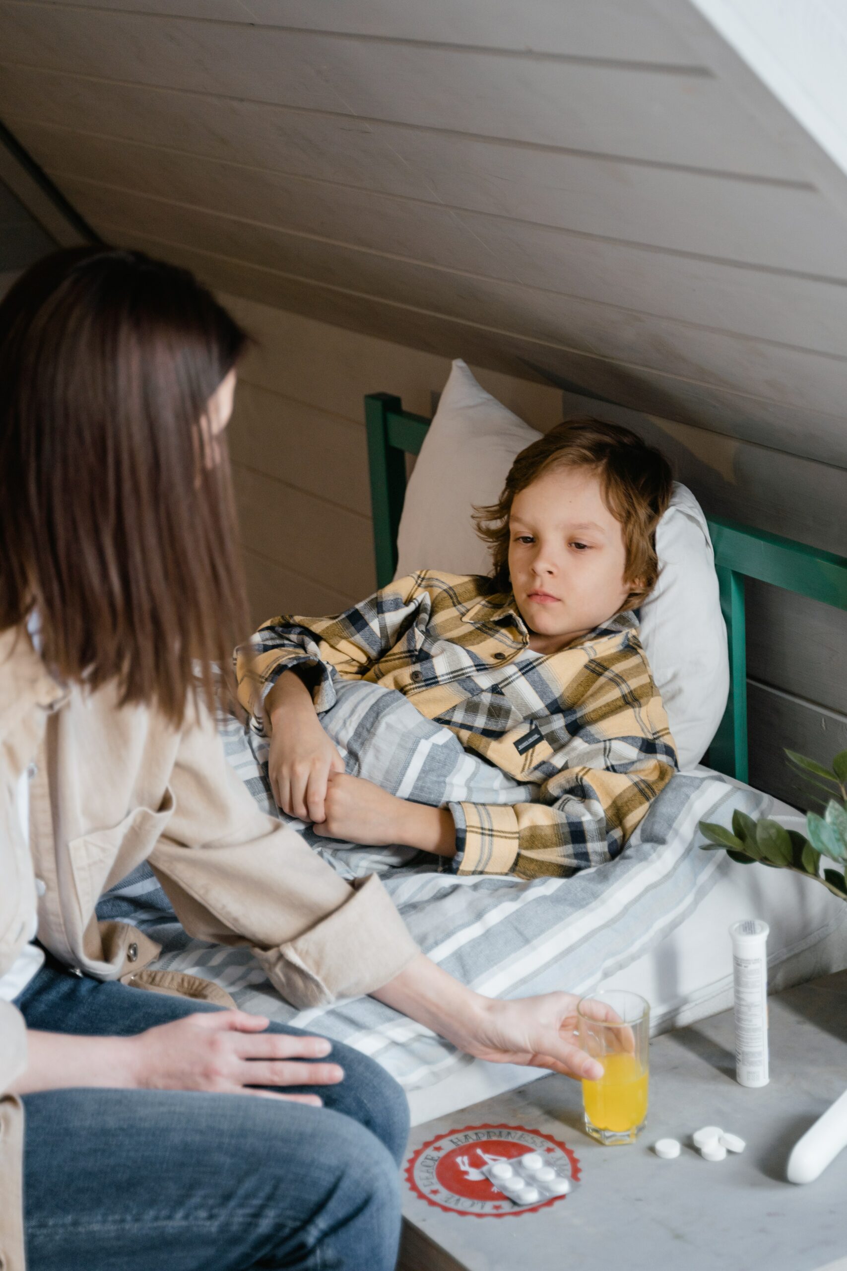 A child looking poorly in bed