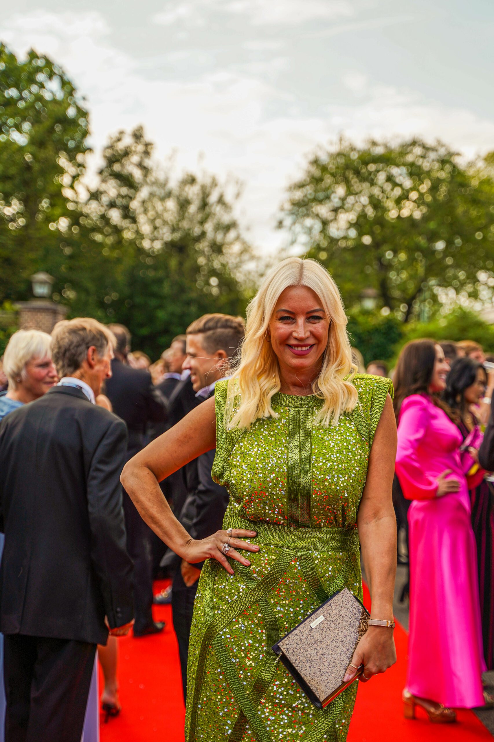 Denise Van Outen posing in a green dress