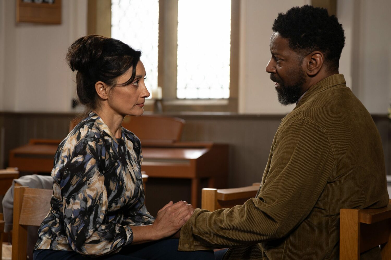 Manpreet and Charles hold hands and lock eyes as he confesses the truth in Emmerdale