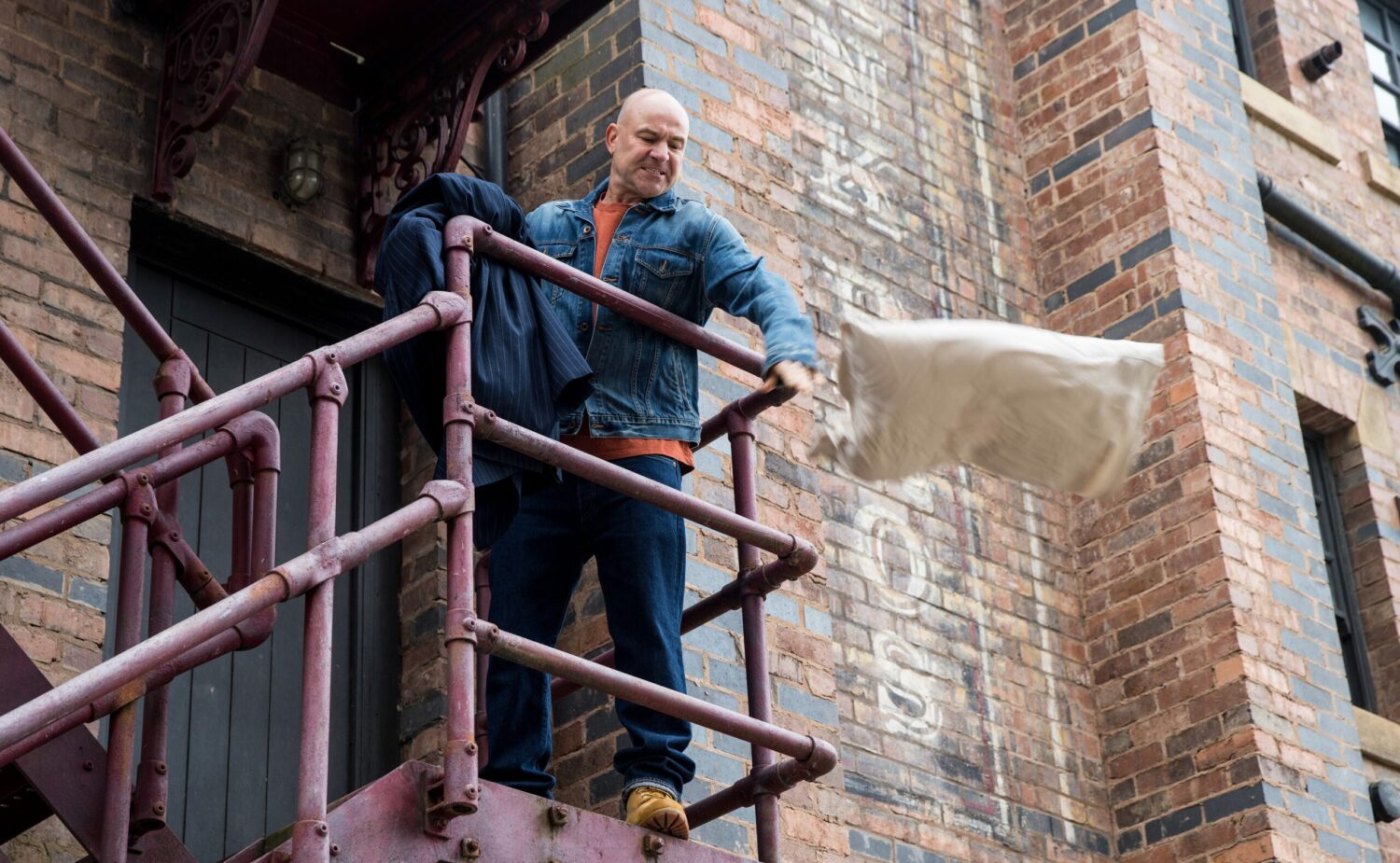 Angry Tim in Coronation Street throws Stephen's belongings off the fire escape