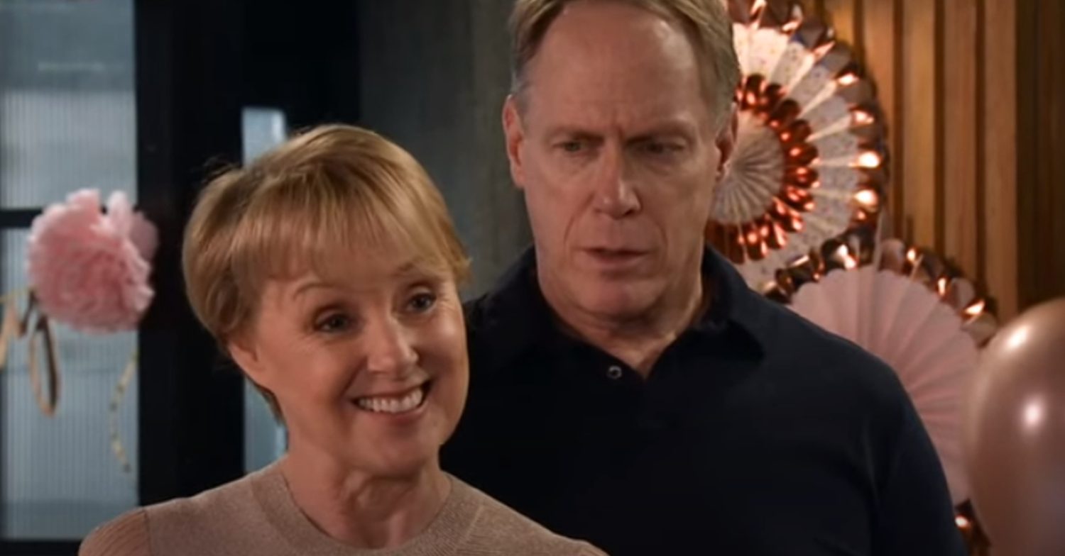 Coronation Street's Sally is smiling whilst Stephen stands behind her sinister