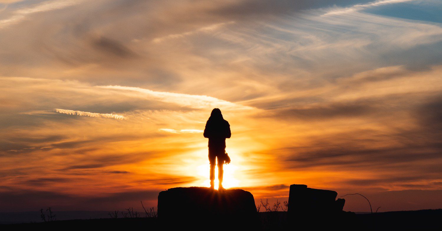 Woman staring at sunset 