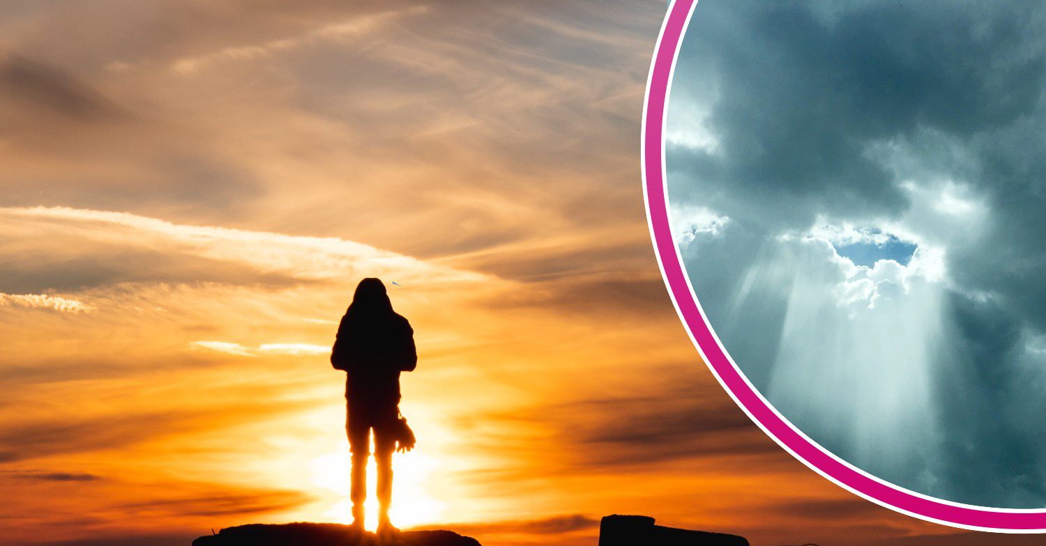Woman standing in front of sunset / clouds