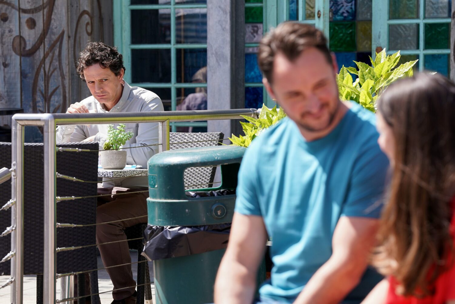 Stacey and Martin talking outside, not knowing that Theo is listening 