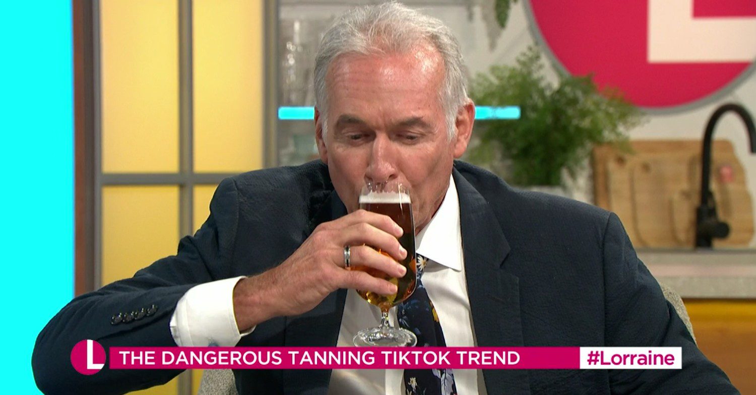 Dr Hilary drinks beer