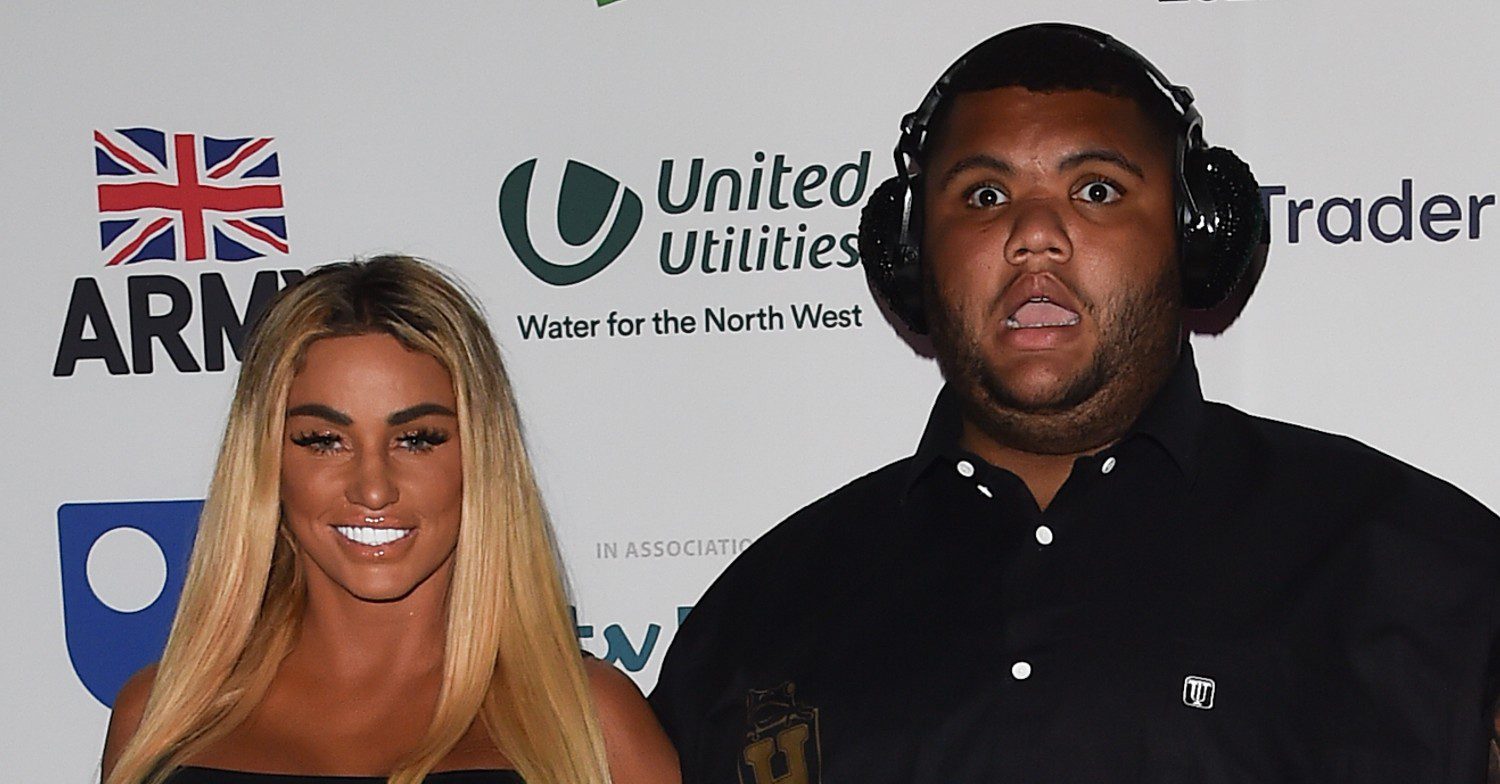 Katie Price smiling with Harvey on a red carpet 