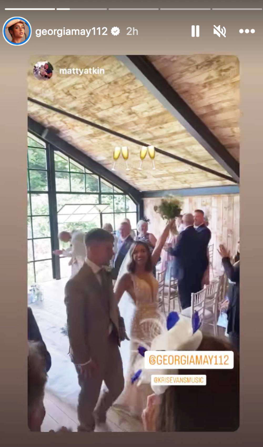 Georgia May Foote raises her bouquet 1