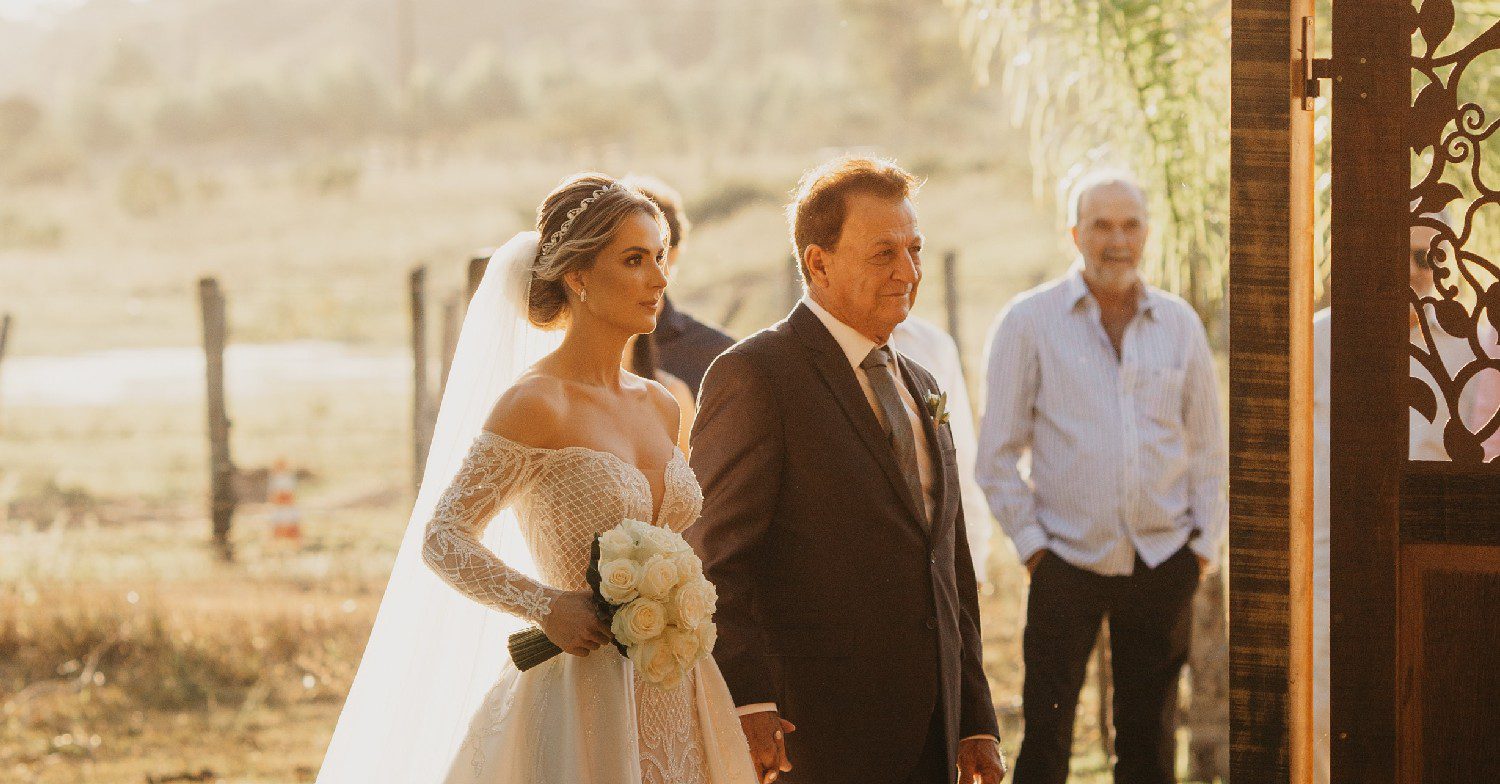 Father walking daughter down the aisle