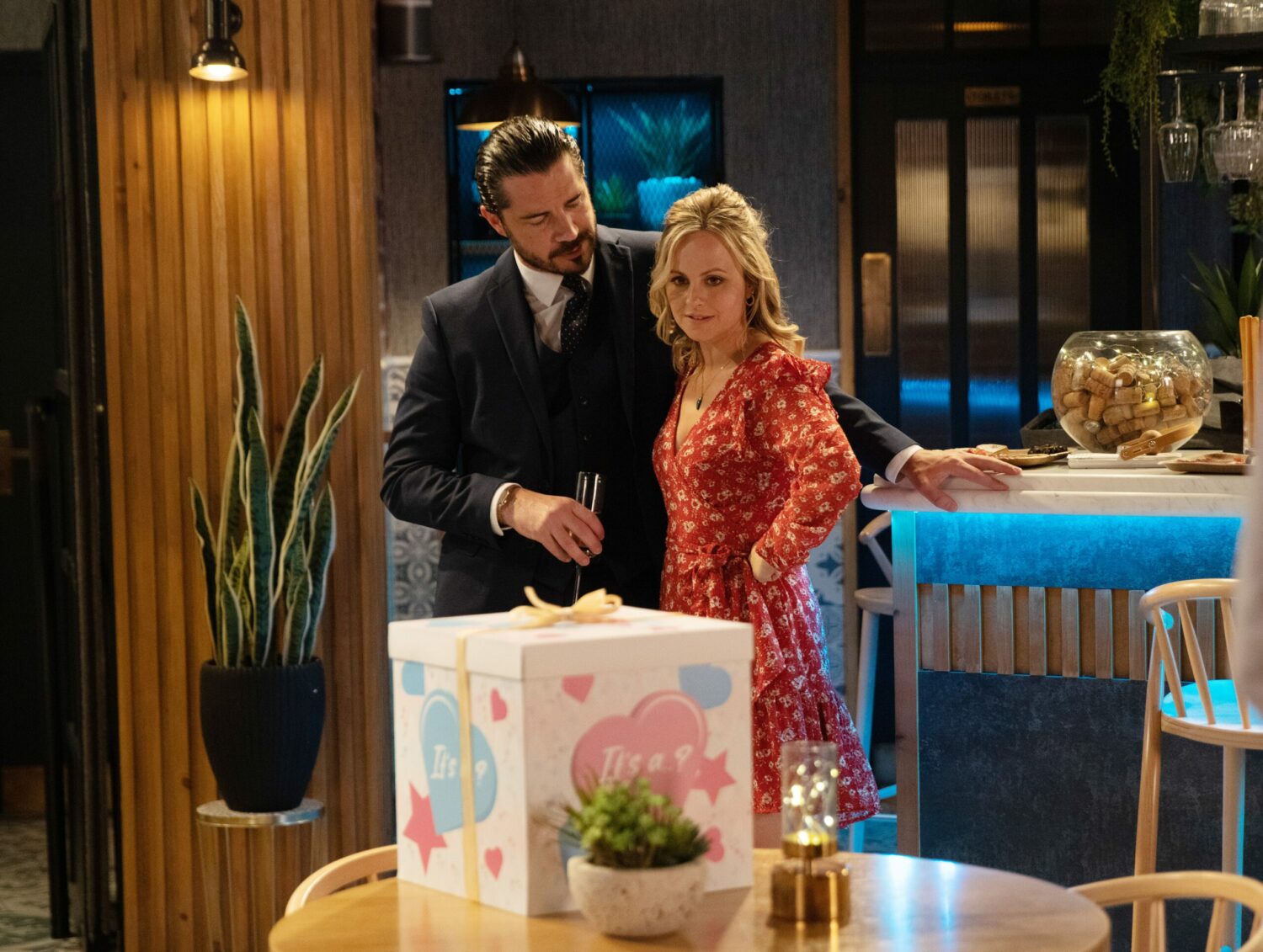Sarah and Adam in the bistro at their baby reveal on Corrie