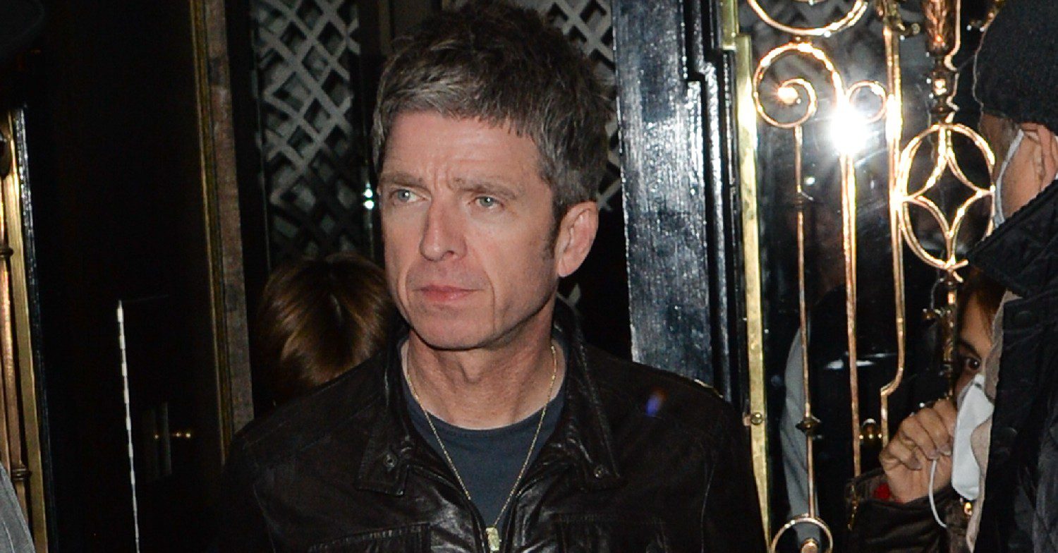 Noel Gallagher posing outside