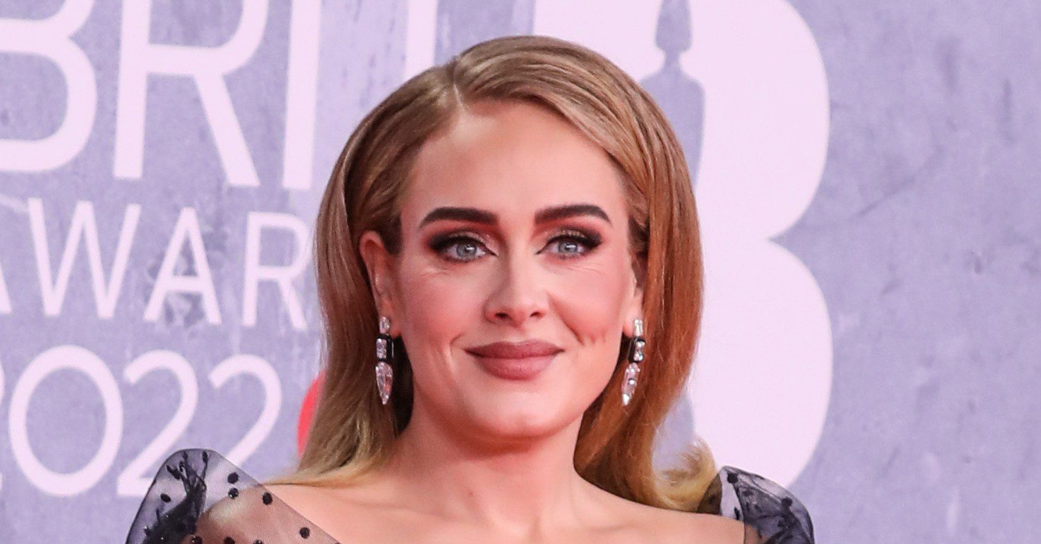 Adele posing on a red carpet 