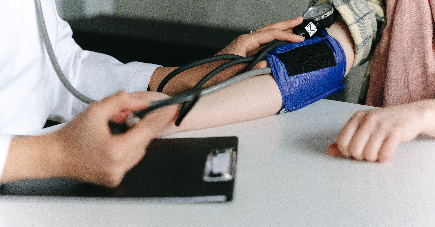 Doctor taking someone's blood pressure 
