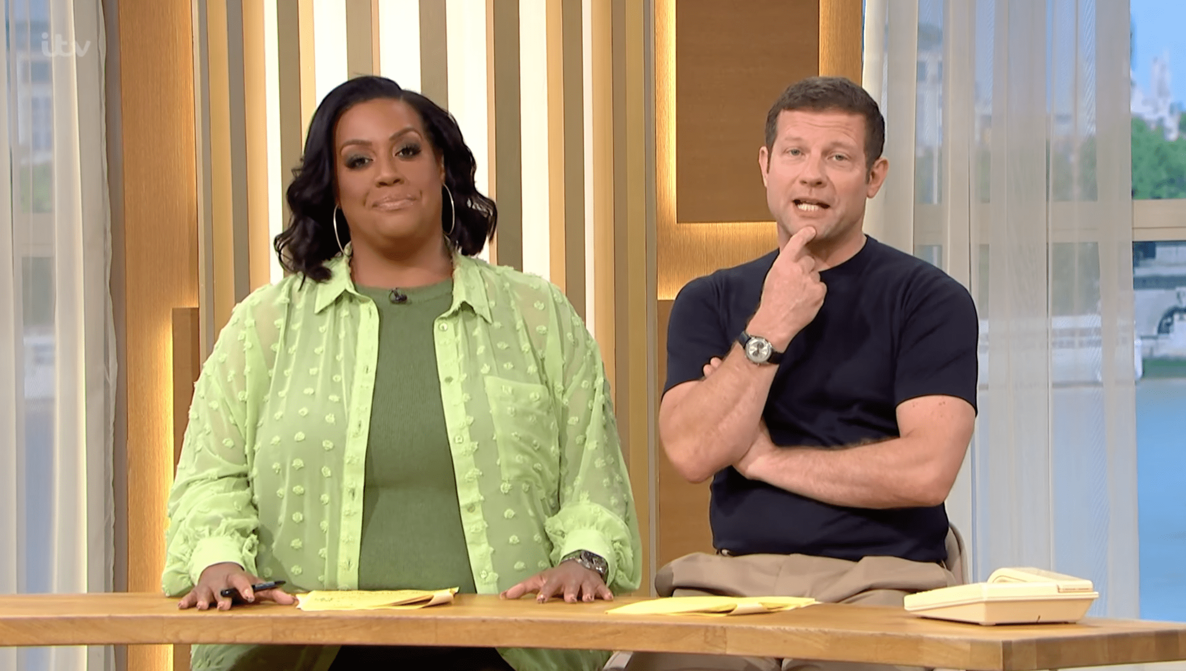 Alison Hammond in green and Dermot O'Leary next to her presenting This Morning