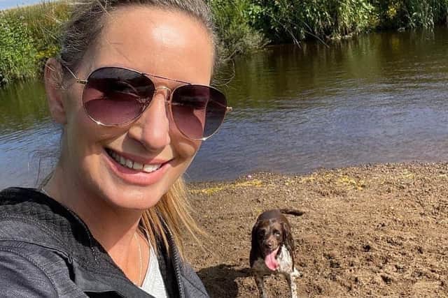 Nicola Bulley smiling in the sun with her dog