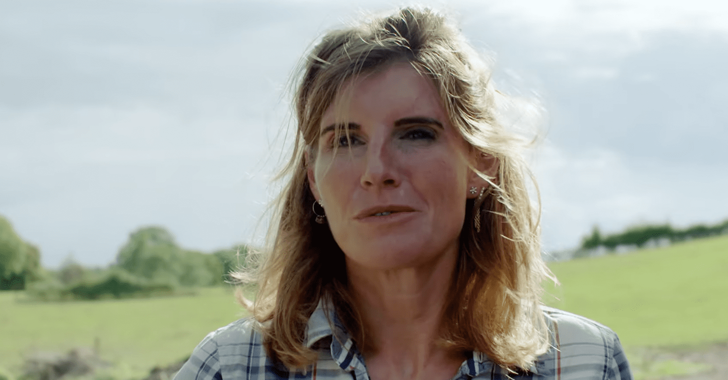 Amanda Owen smiling on a farm