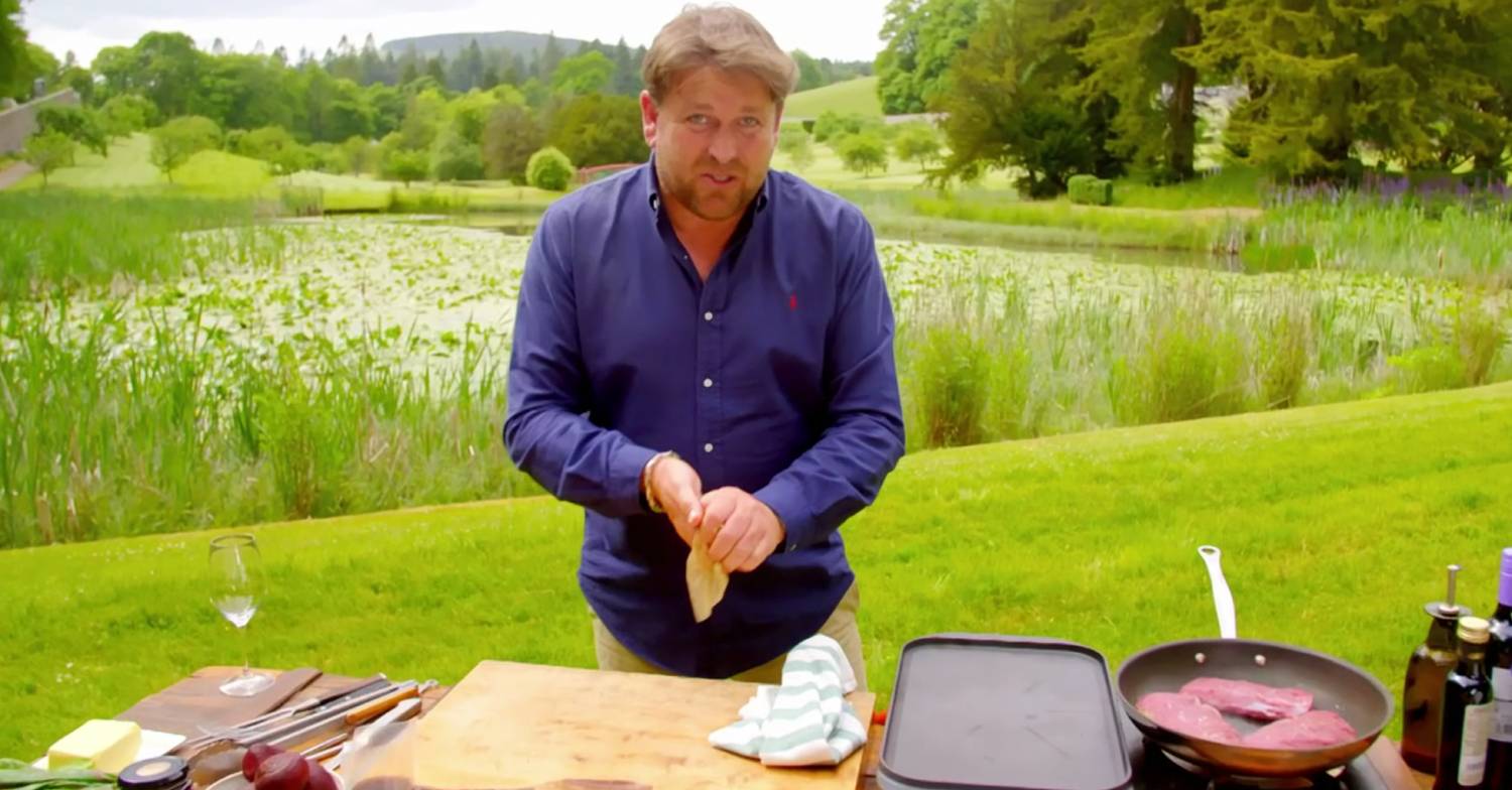 James Martin prepares a dish during an episode of Great British Adventure