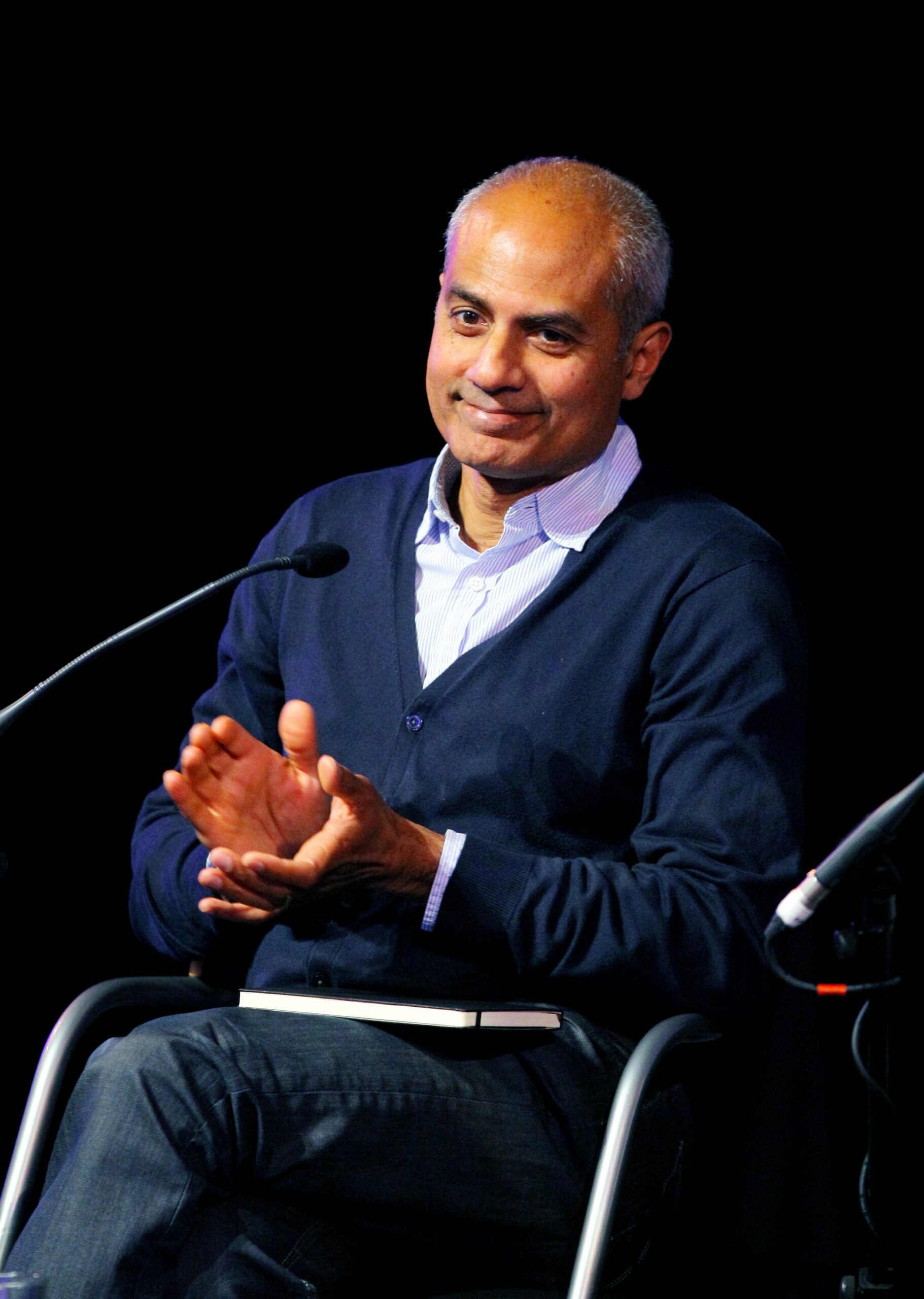 George Alagiah clapping during chat