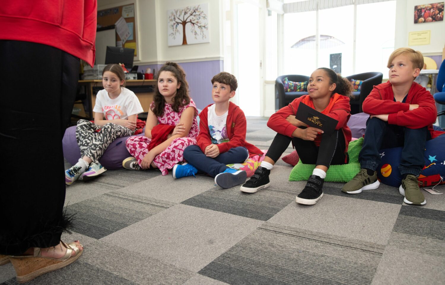 Ruby, Hope and other children at the community centre with Glenda