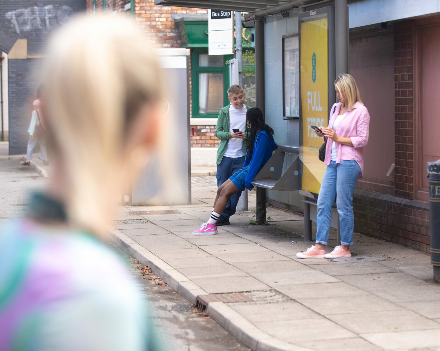 Corrie: Lauren watches Max and Sabrina laughing at the bus stop