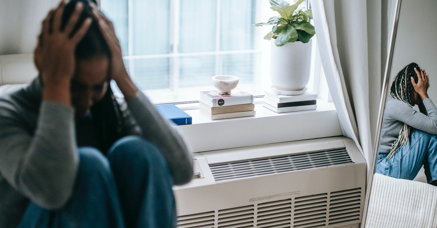 Woman with her head in her hands