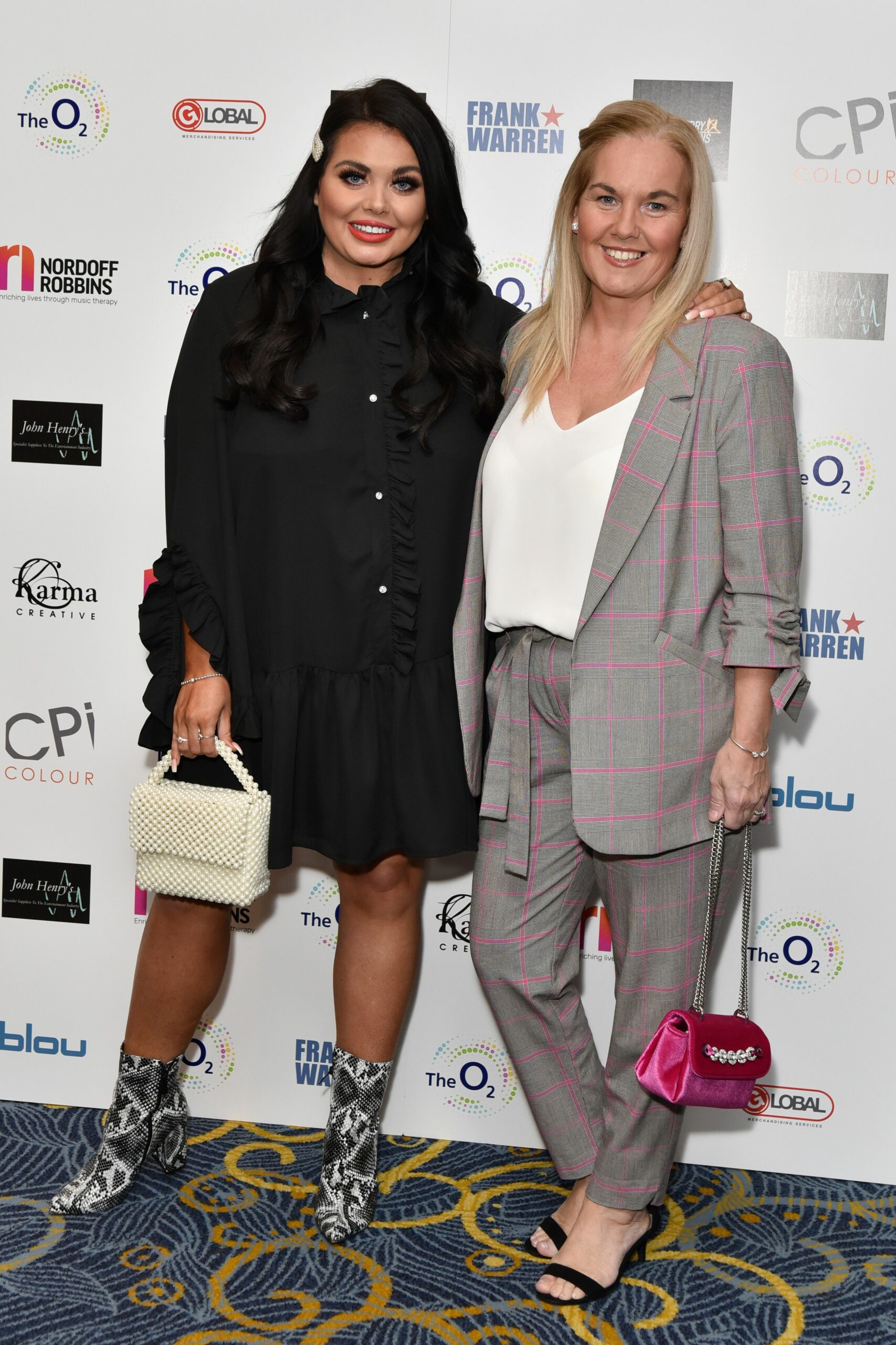 Scarlett Moffatt posing with her mum Betty at event