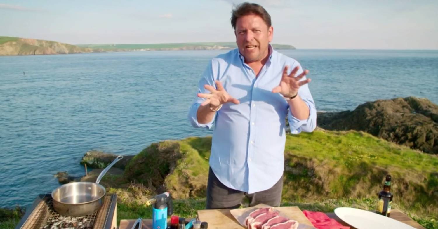 James Martin gestures while cooking