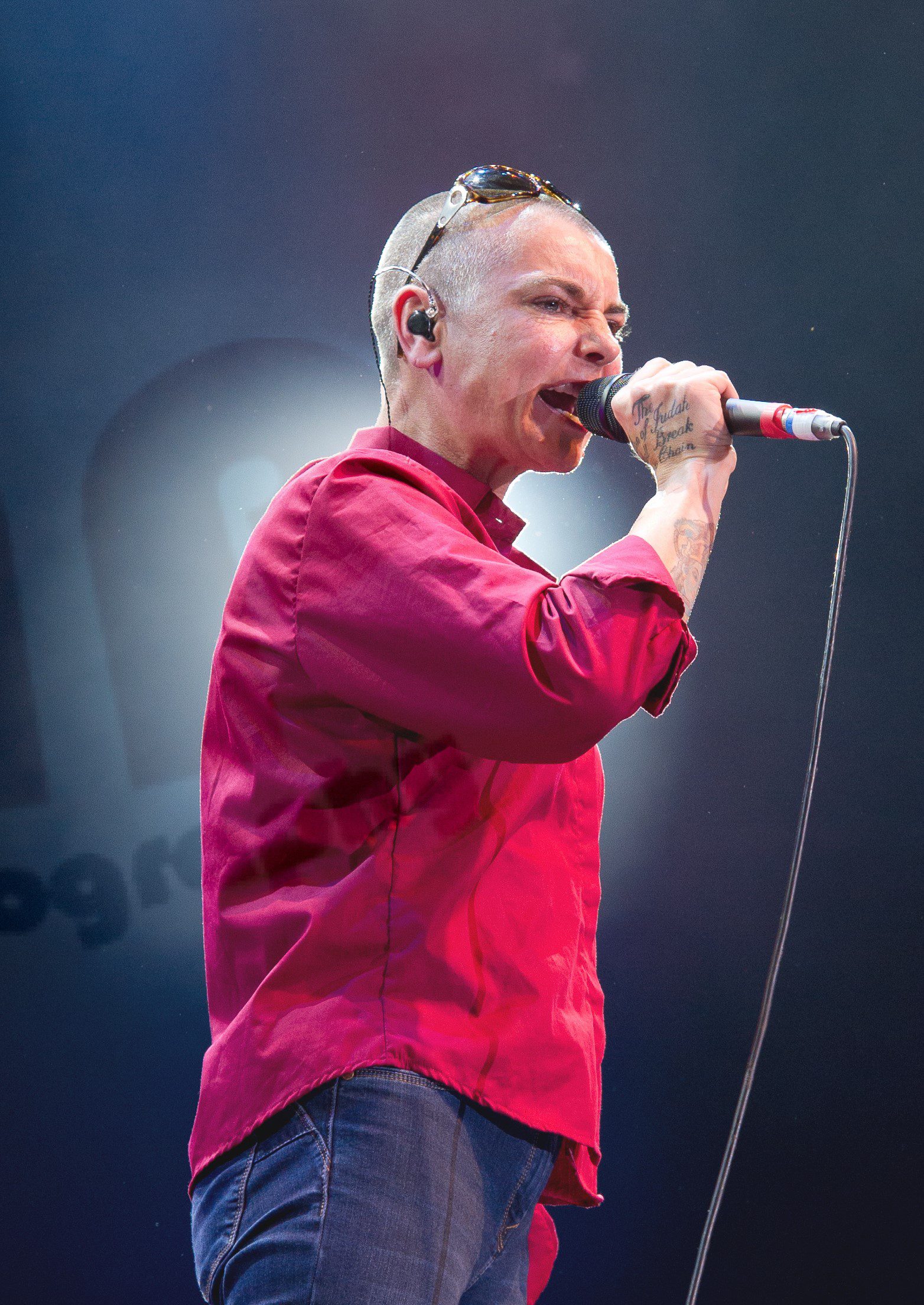 Sinead O'Connor singing on stage