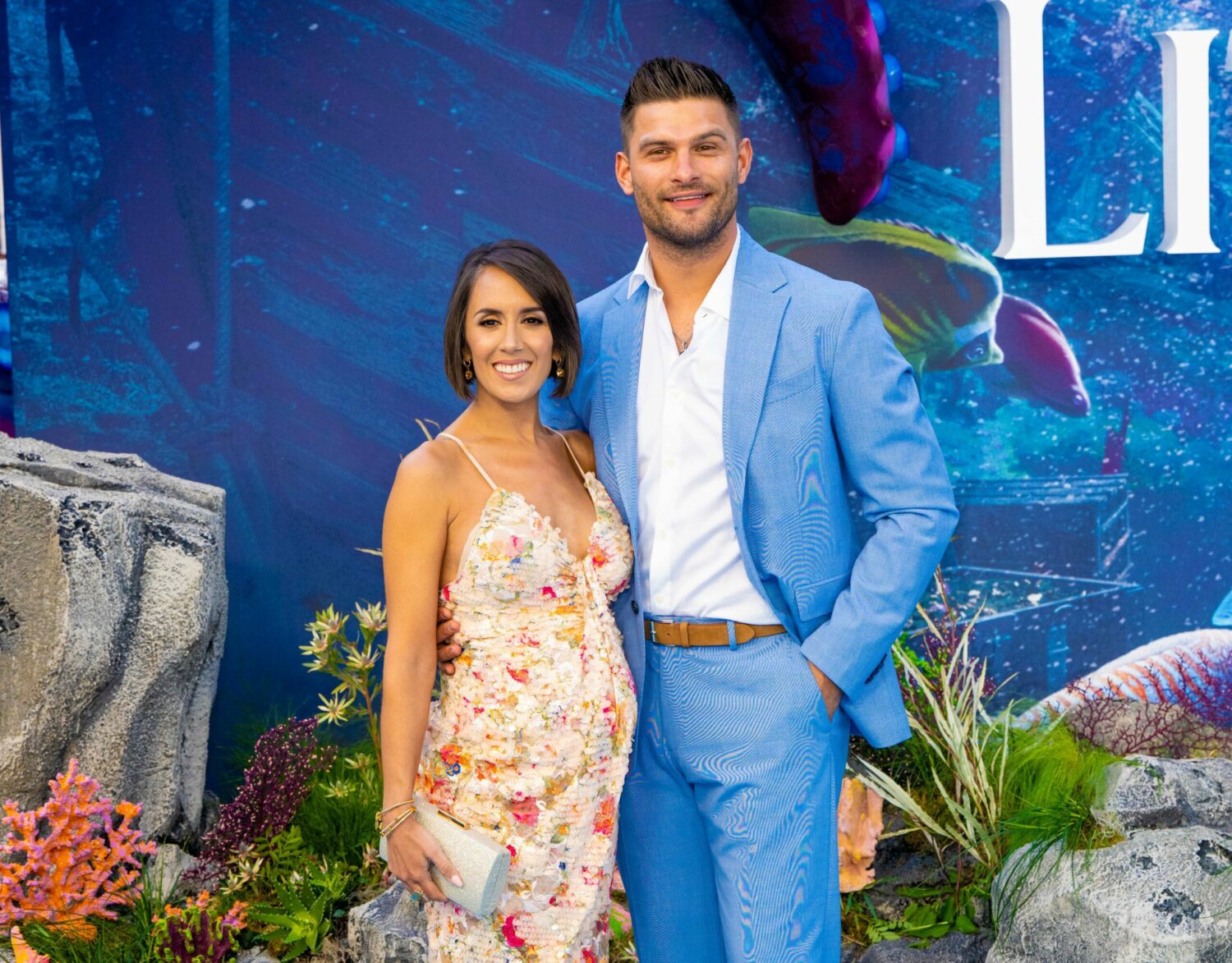 Janette Manrara and Aljaz Skorjanec smile on the red carpet at The Little Mermaid premiere