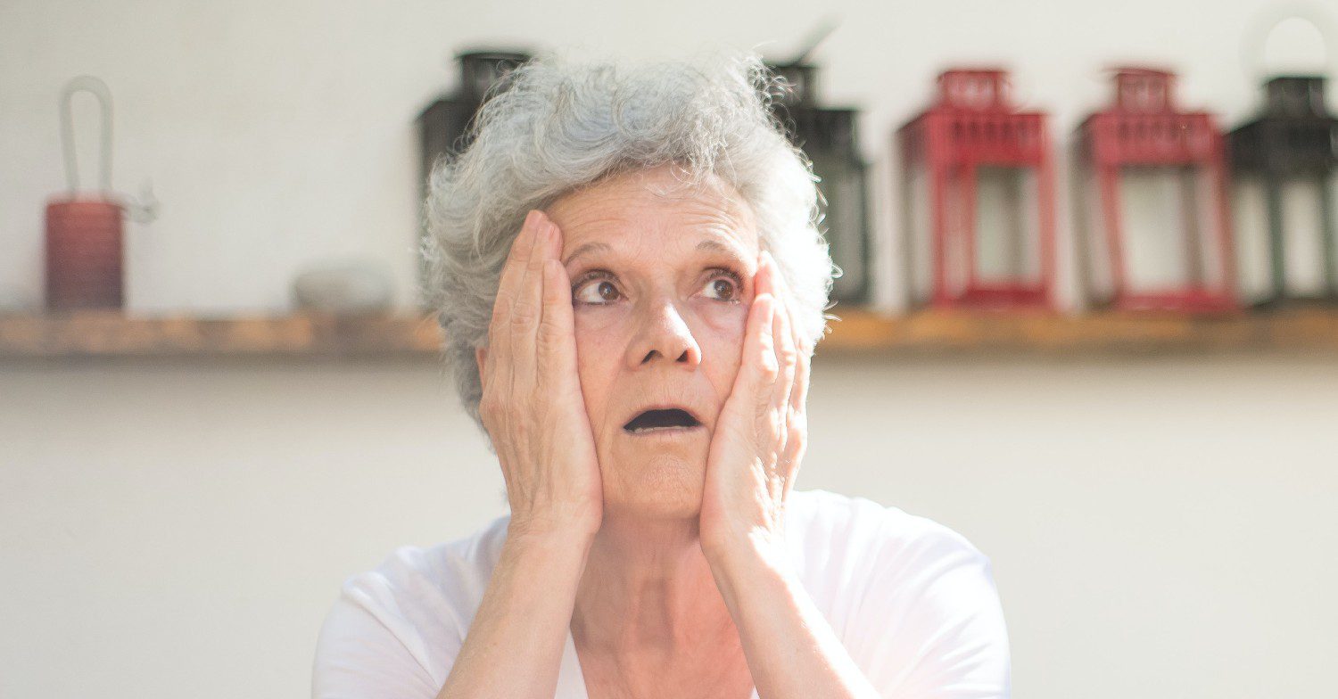 Old woman looking shocked 