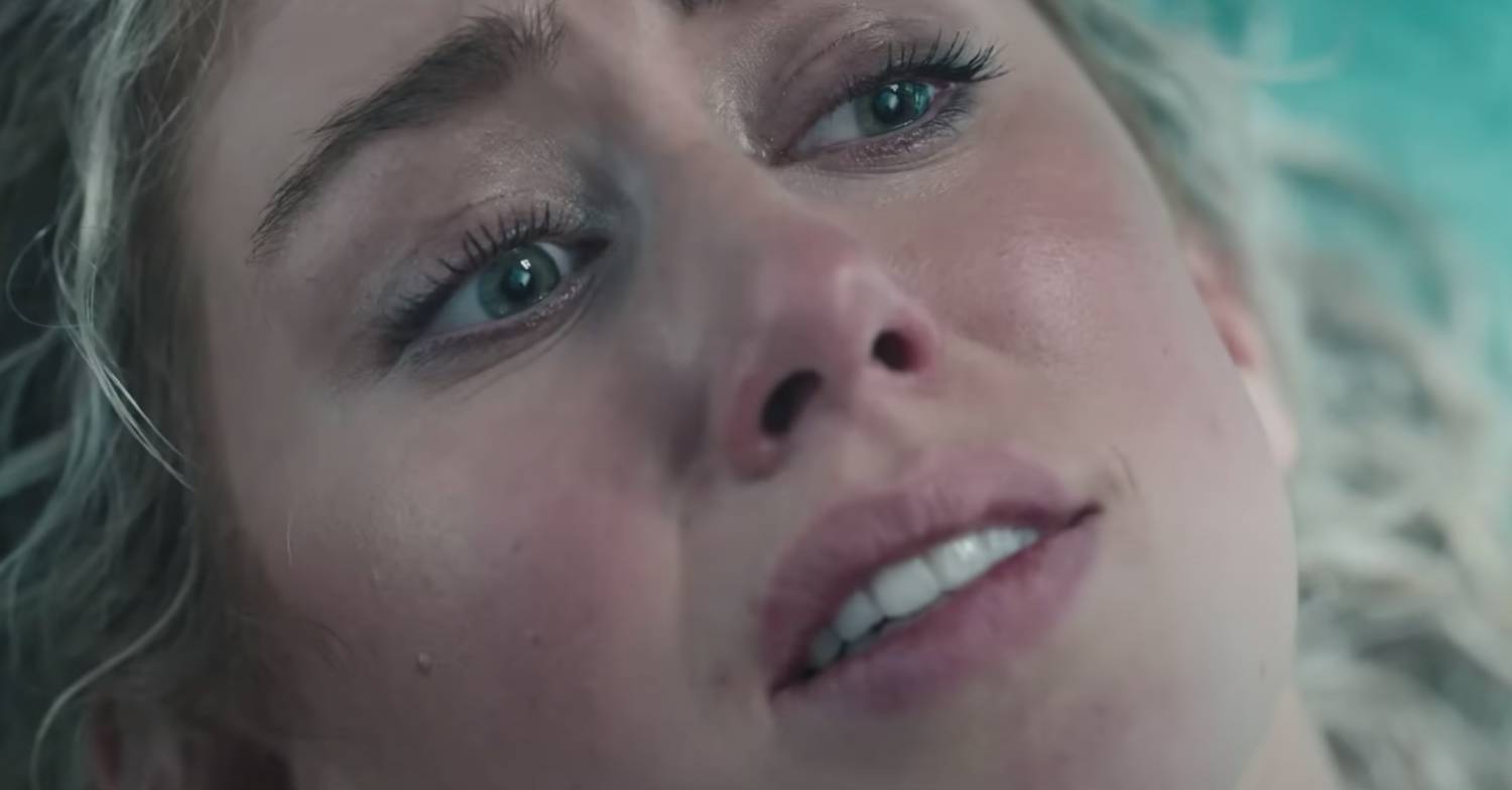 Woman looks terrified in the Slotherhouse trailer