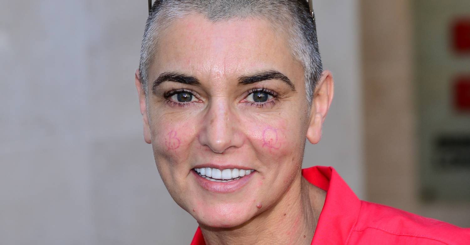 Sinead O'Connor smiles at the camera