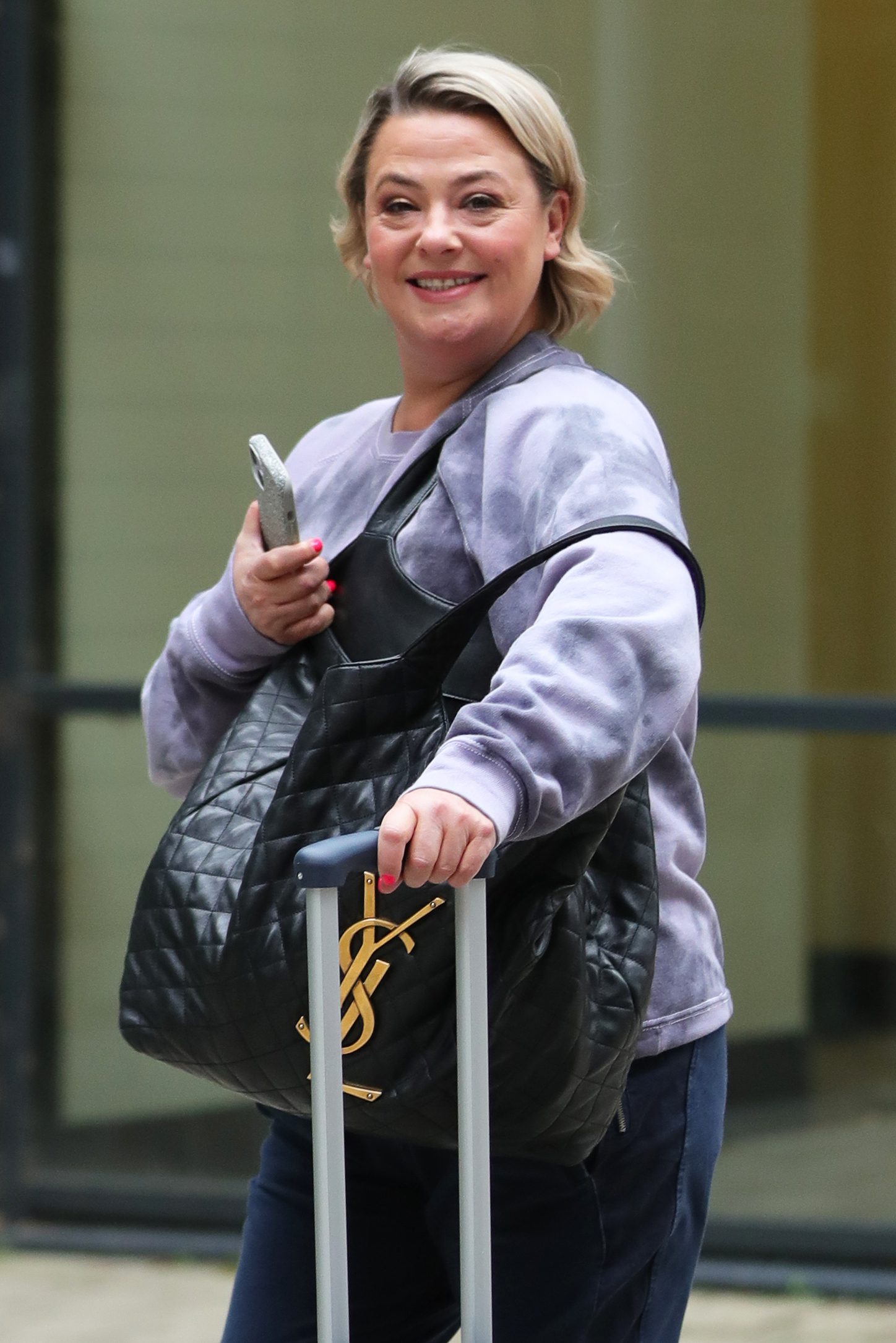 Lisa Armstrong with her suitcase at Leeds Dock