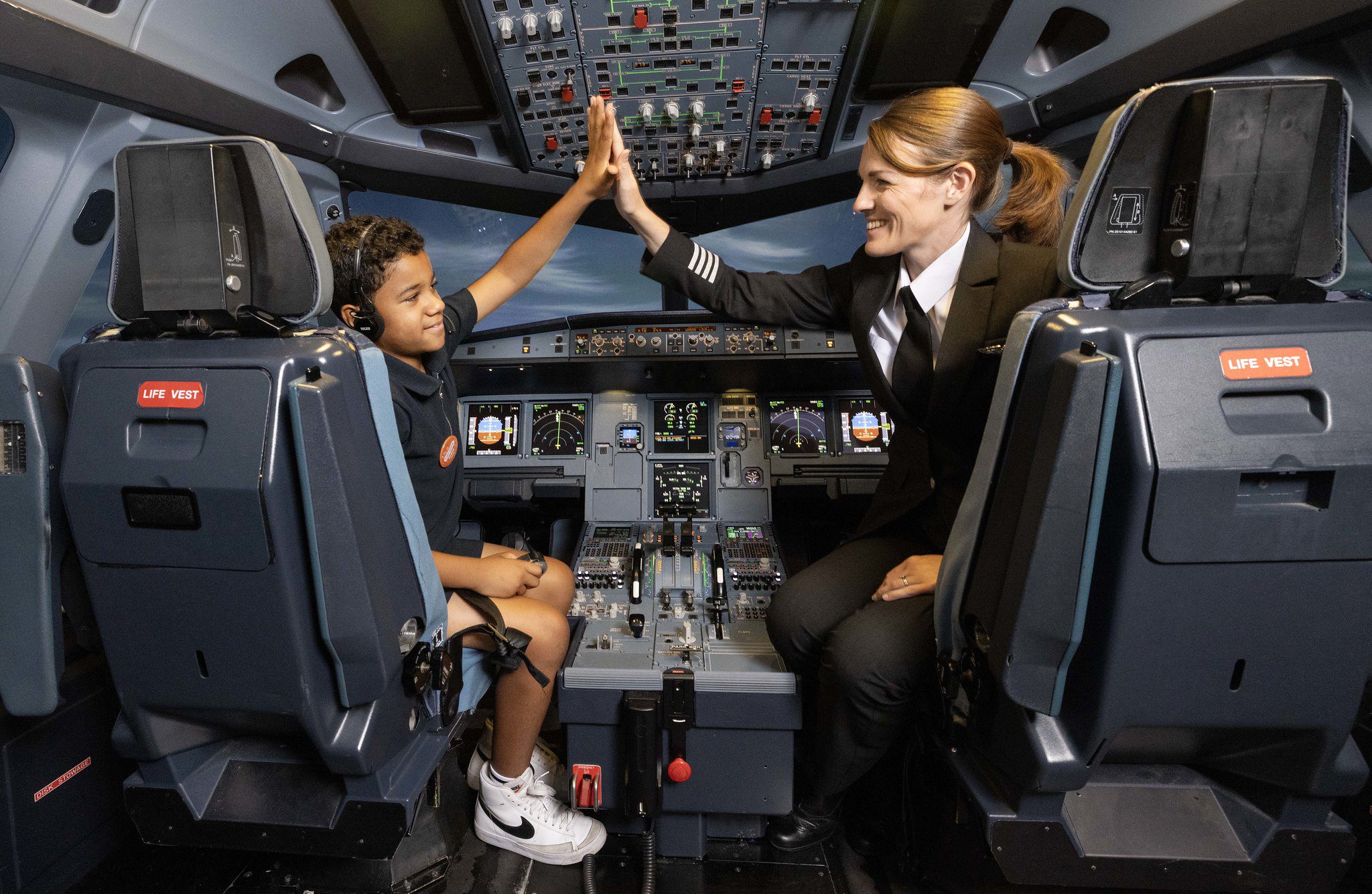 Captain and a child in the EasyJet cockpit