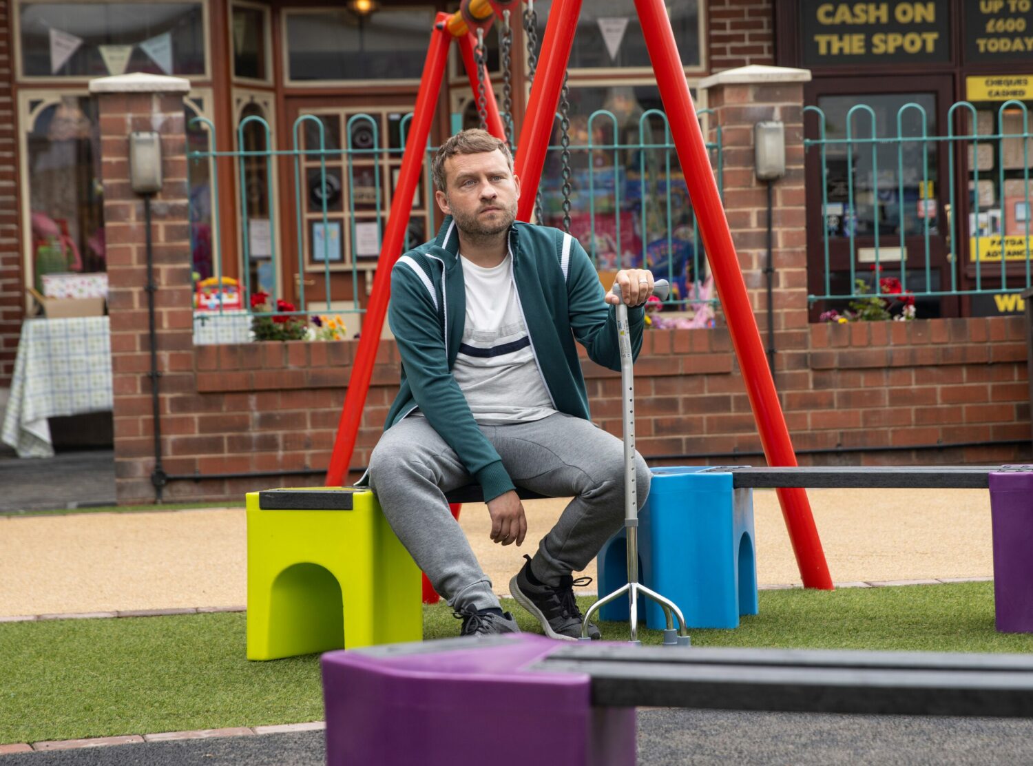 Paul look sad at the playground in Corrie