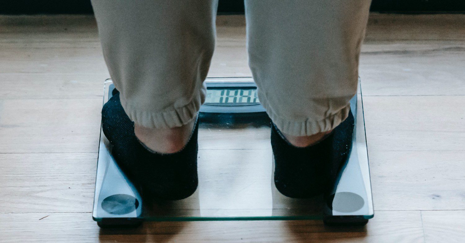 Feet standing on scales
