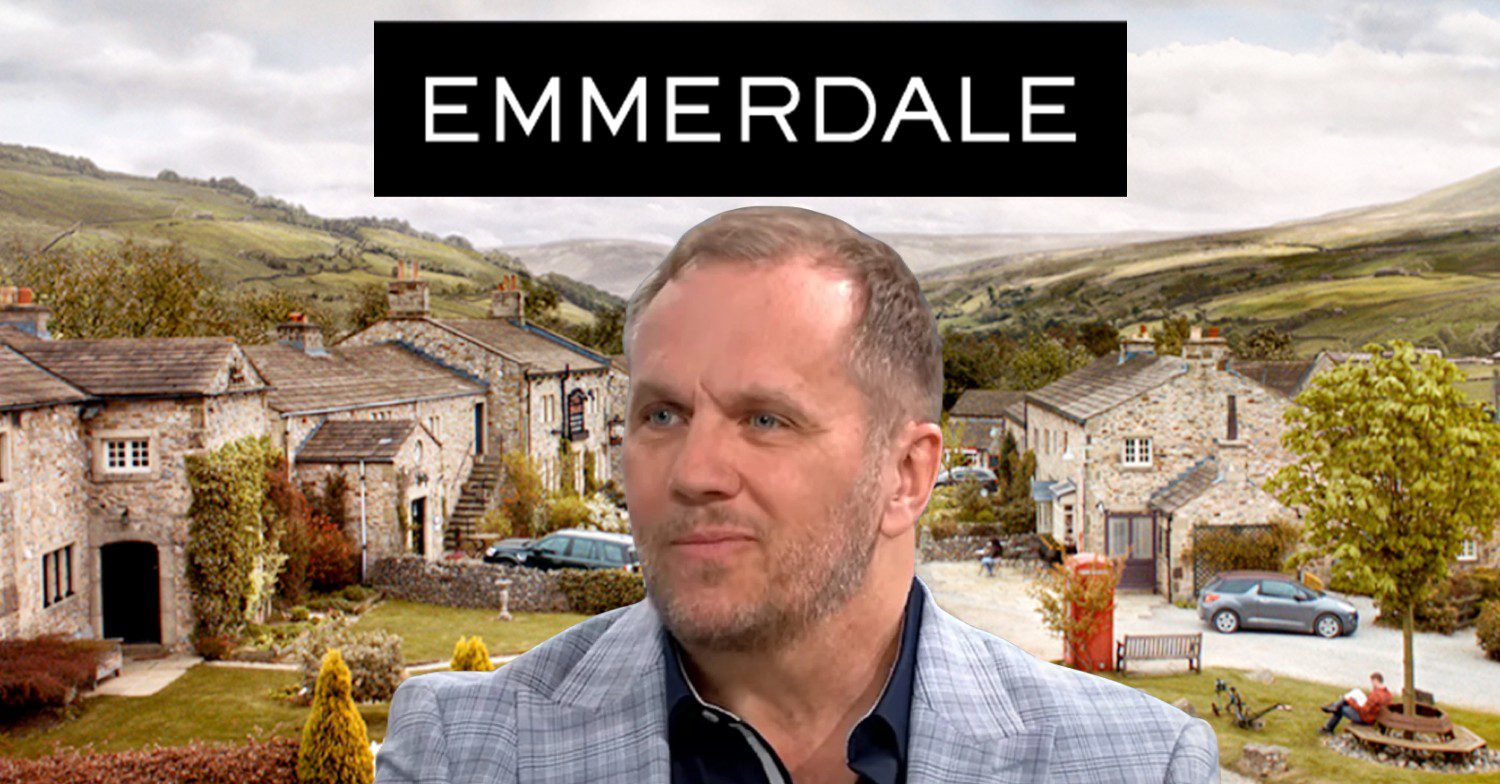 Dean Andrews smiling against Emmerdale logo and village background (Credit: ITV/Composite: ED/YouTube)