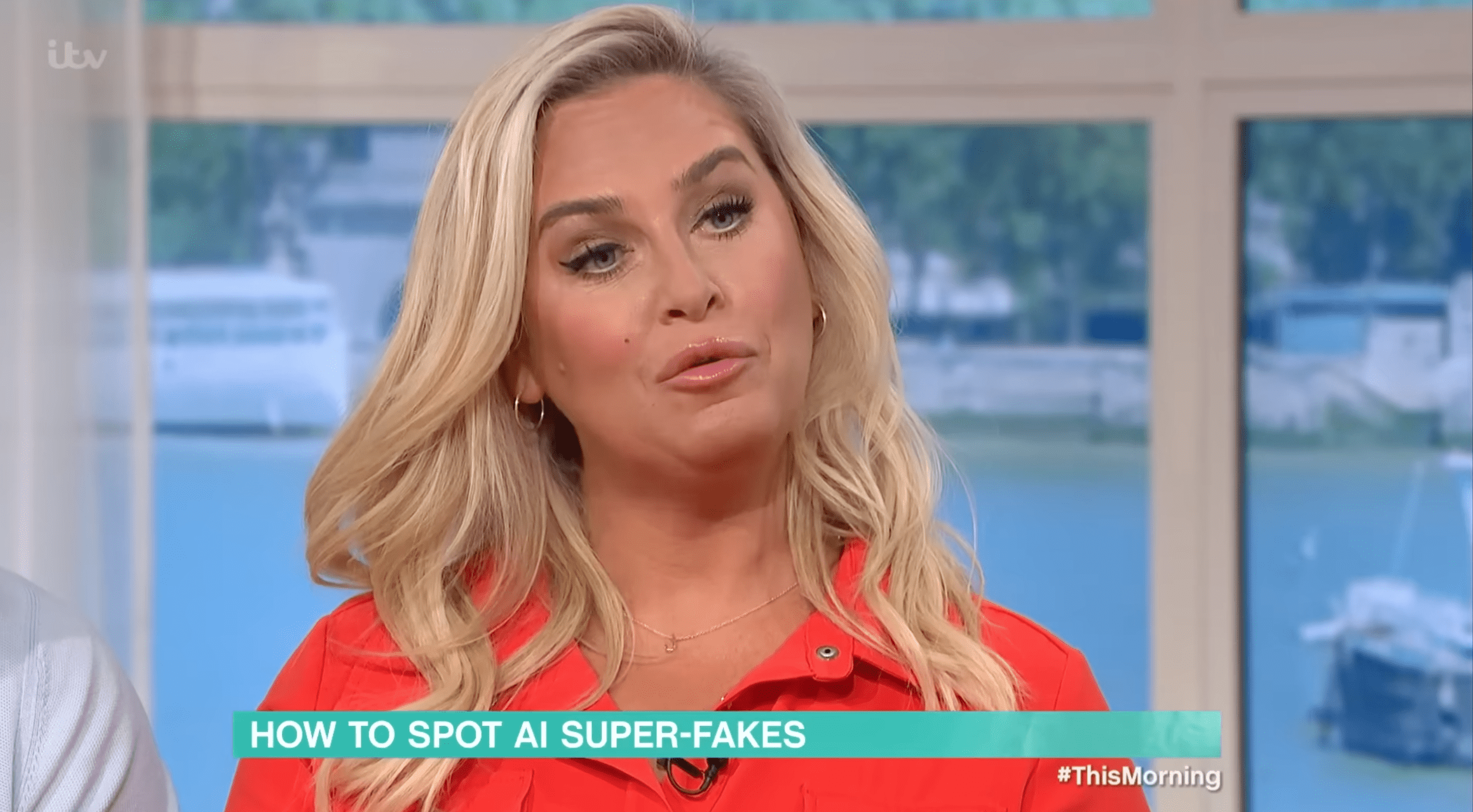 Josie Gibson presenting This Morning in a red dress