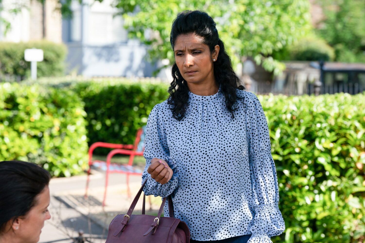 EastEnders' Suki is outside, looking at Eve with concern