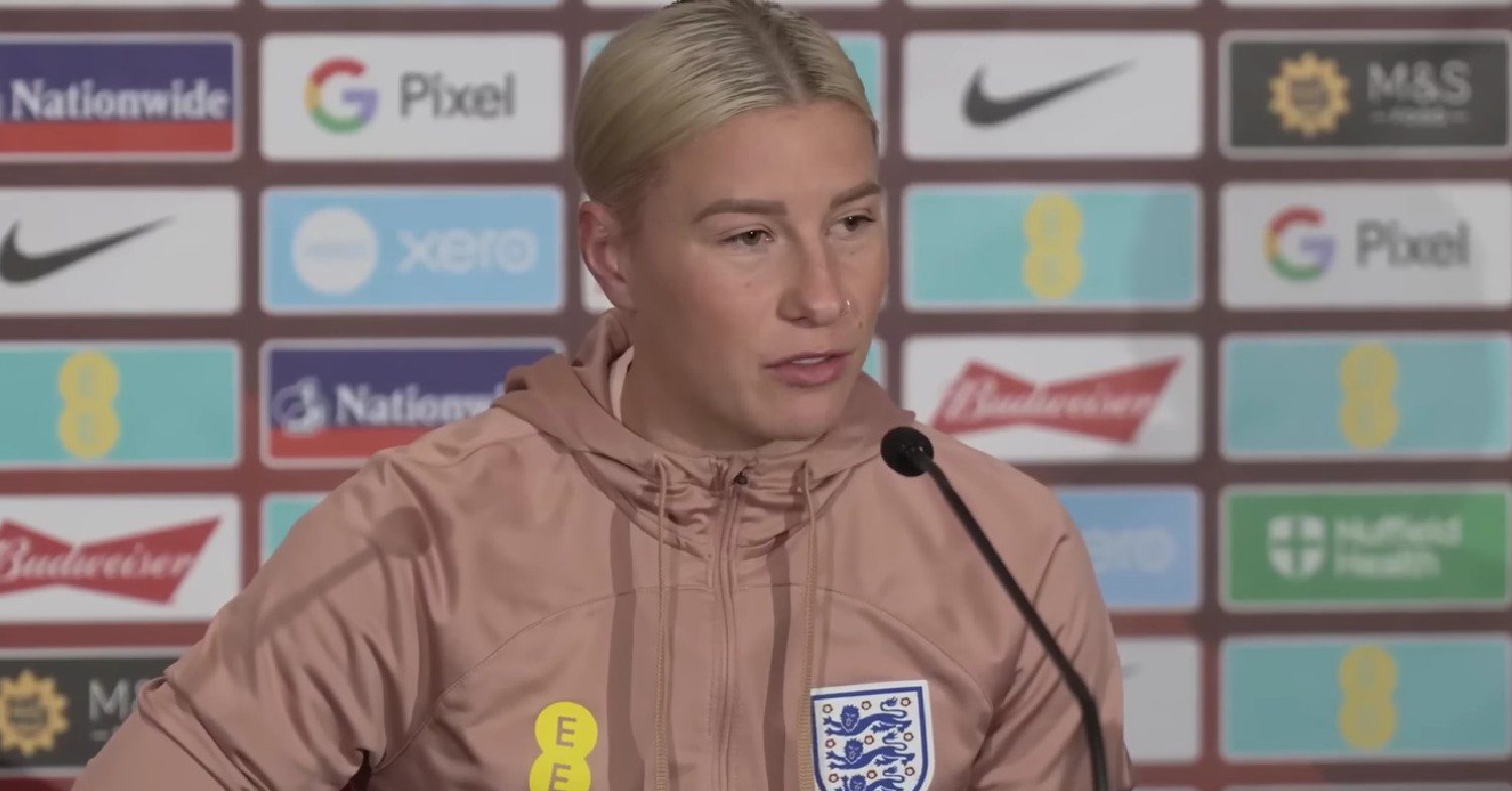 Beth speaking at a football conference 