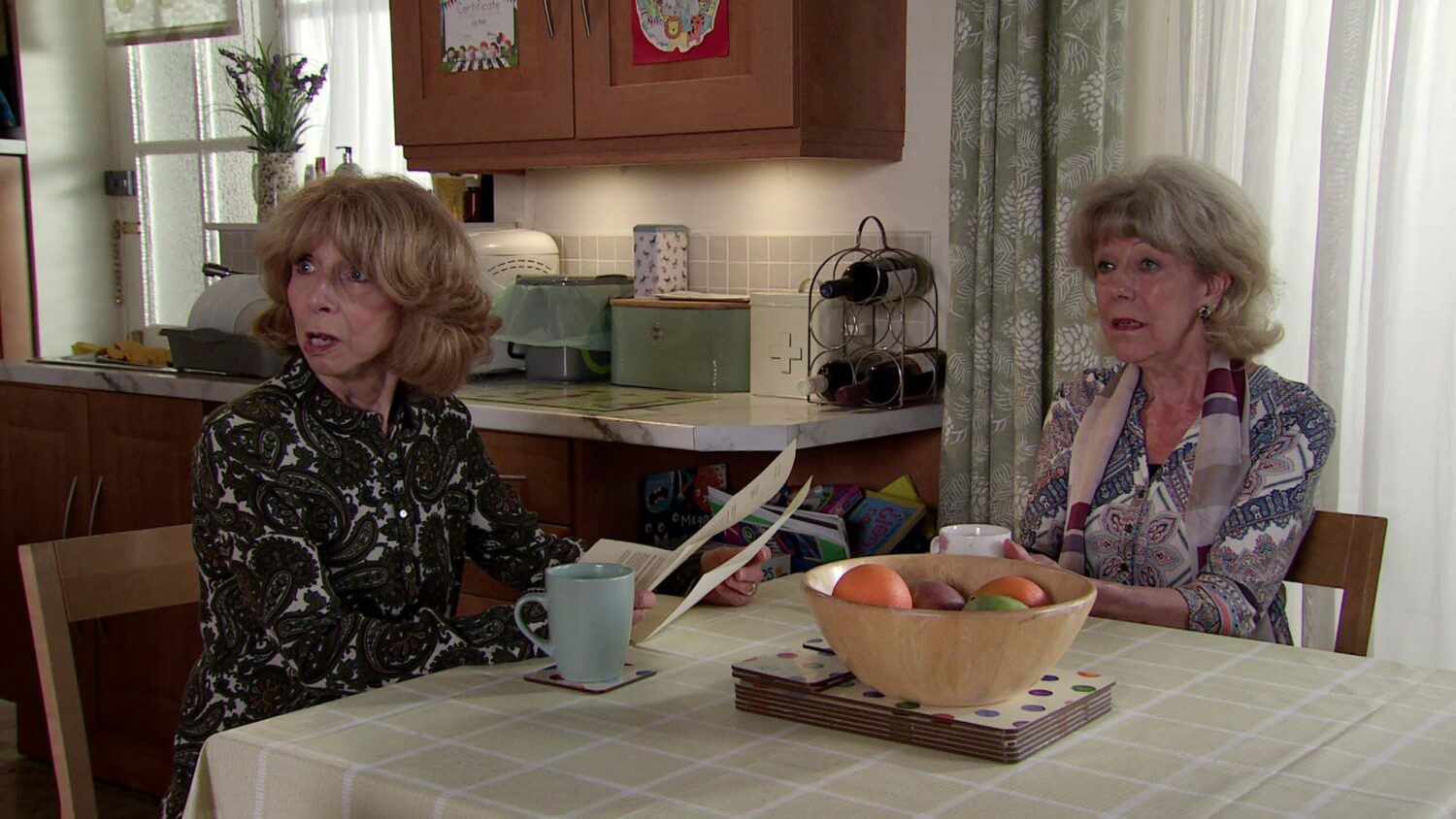 Gail and Audrey look shocked at home on Corrie