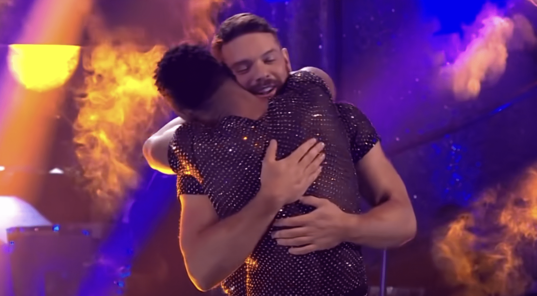Johannes Radebe and John Whaite embracing