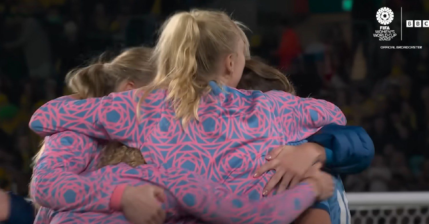 The England Lionesses hug after Australia win