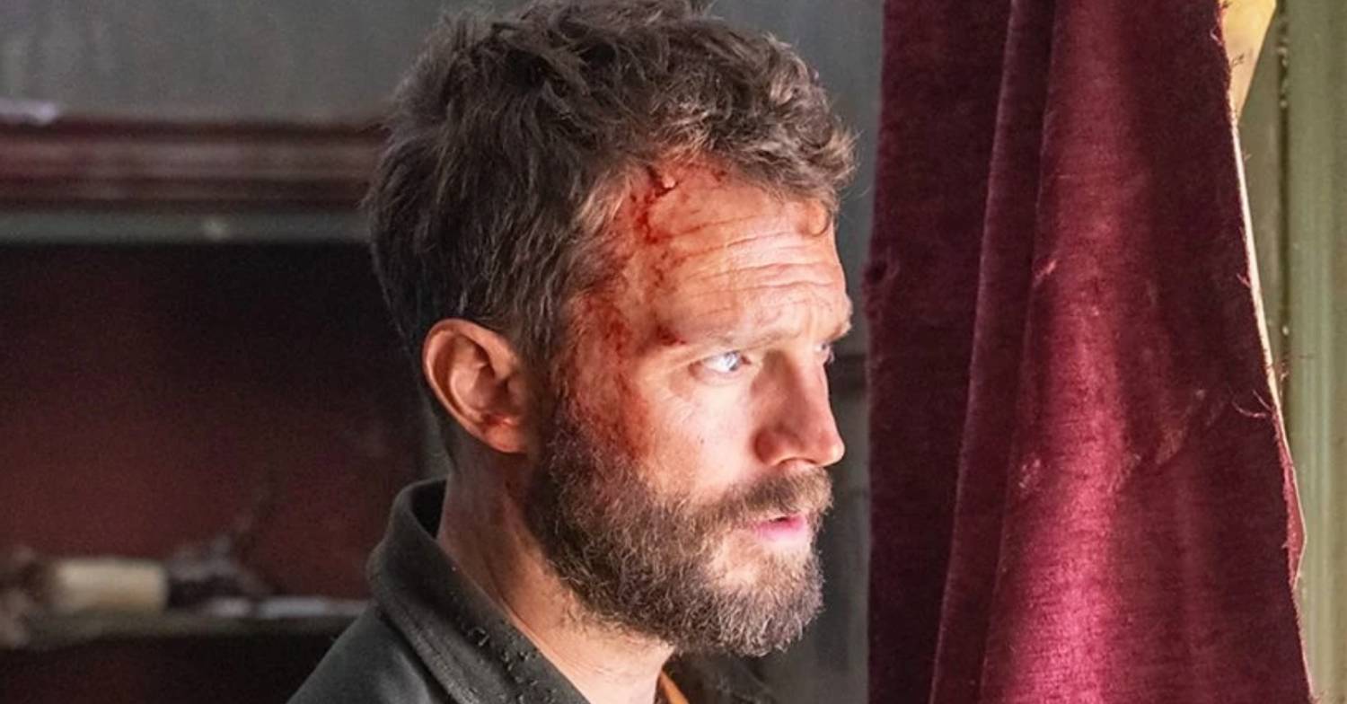 Jamie Dornan as Elliot Stanley peers in The Tourist series 2