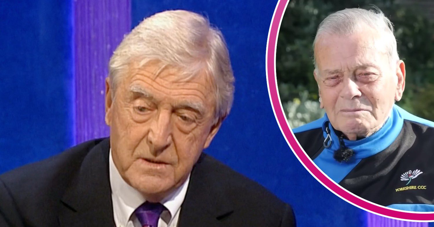 Michael Parkinson looks downward, Dickie Bird is tearful