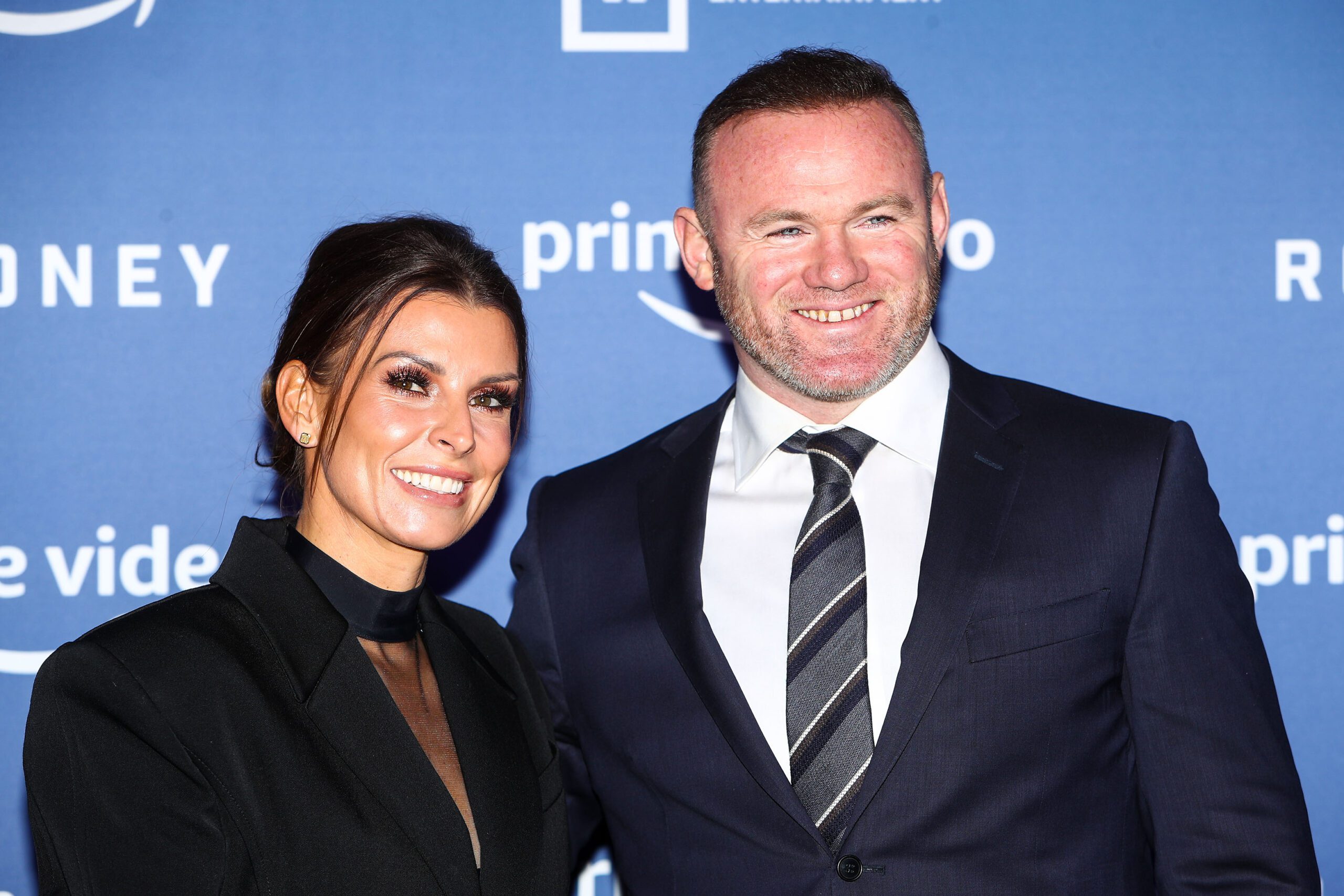 Coleen and Wayne Rooney smiling
