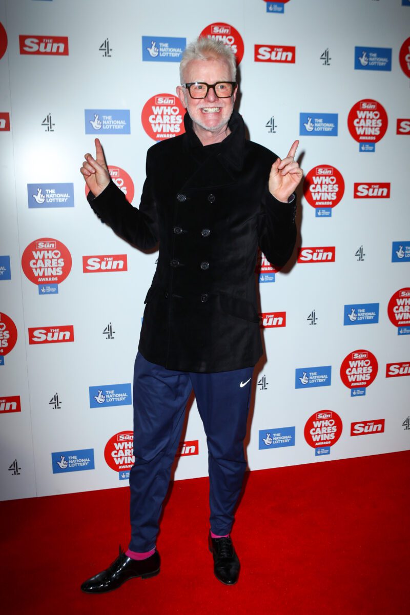 DJ Chris Evans smiling on the red carpet
