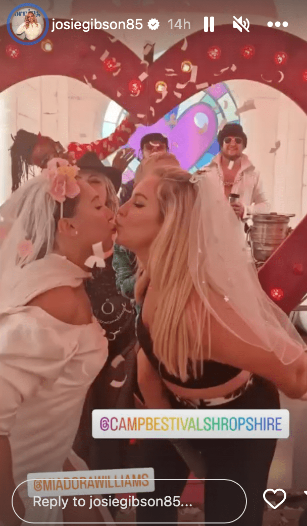 Josie Gibson dressed as a bride kissing her friend