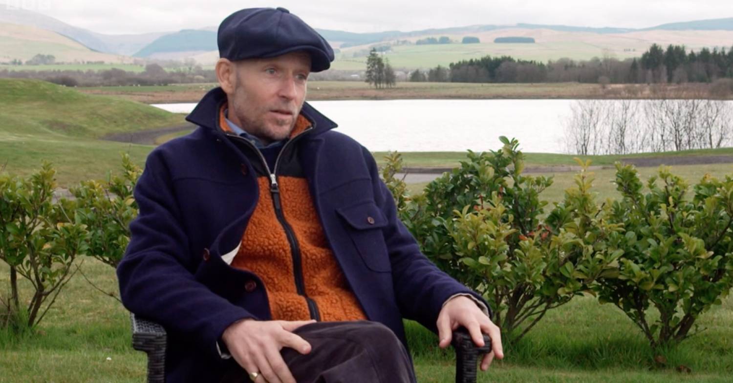 Jonnie Irwin sits in a chair