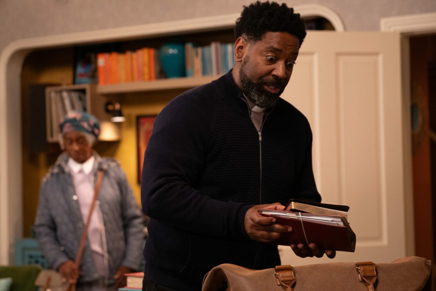 Charles in Emmerdale spoilers looks shocked as he packs books in his bag